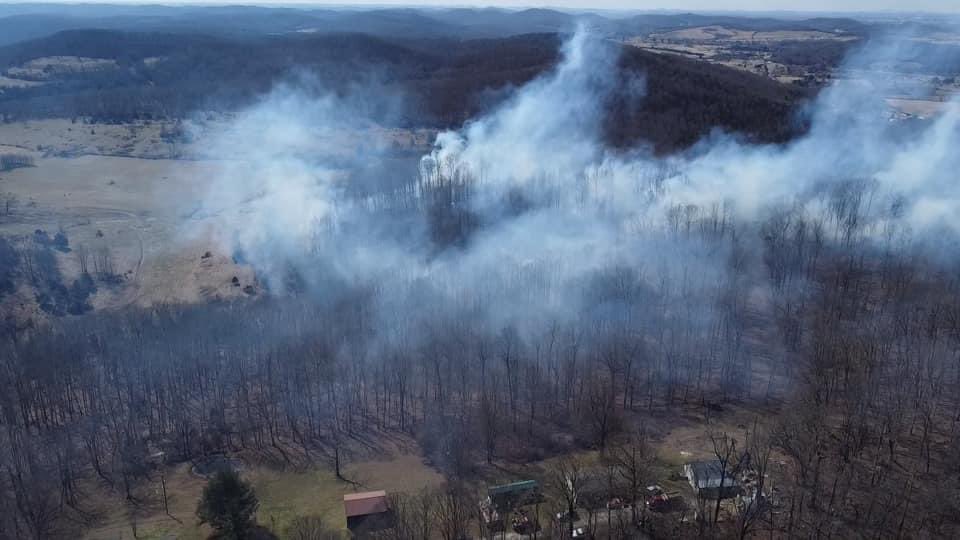 Officials say the fire is near Bright Shade Lane, off Sand Springs Road, south of Mt. Vernon.  Firefighters say the wind got in some power lines, caused a short, which caught a utility pole on fire, followed by the nearby woods.    15 to 20 acres are burning