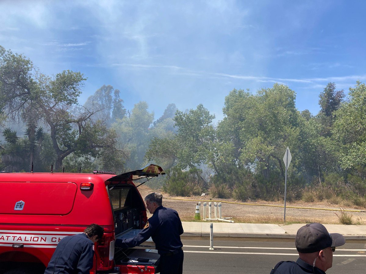 Firefighters have knocked down the brush fire. They held it to 1/2 acre. No structures damaged or threatened. Several fire crews will be here making sure no hot spots remain