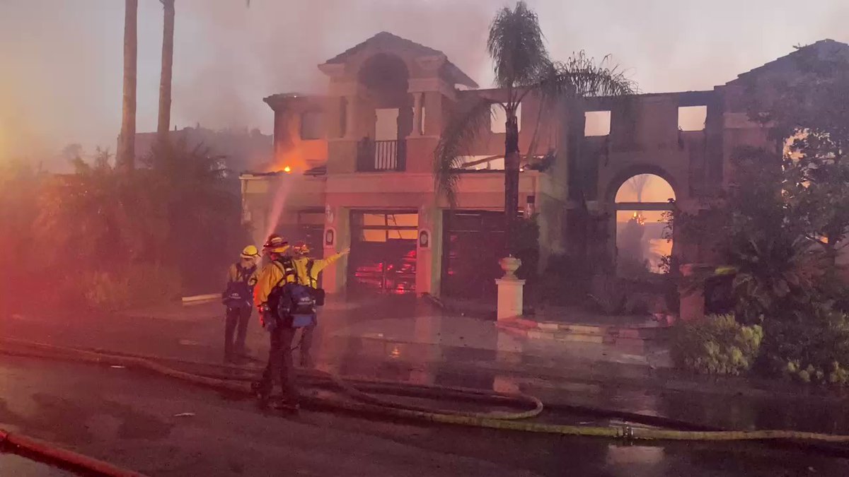 Houses on both sides of Coronado Pointe are burning in Laguna Niguel