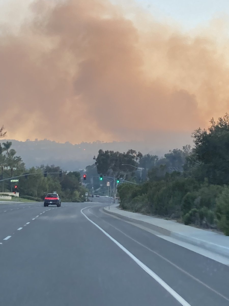 Driving down Crown Valley towards the fire, you can see flames on the hillside