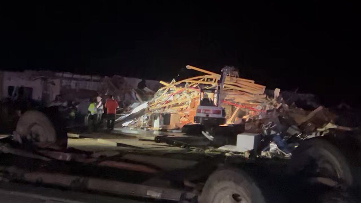 Dozens of men working the scene searching for tornado victims here in RollingFork where the destruction is so complete heavy equipment is needed to clear and pick thru the rumble.