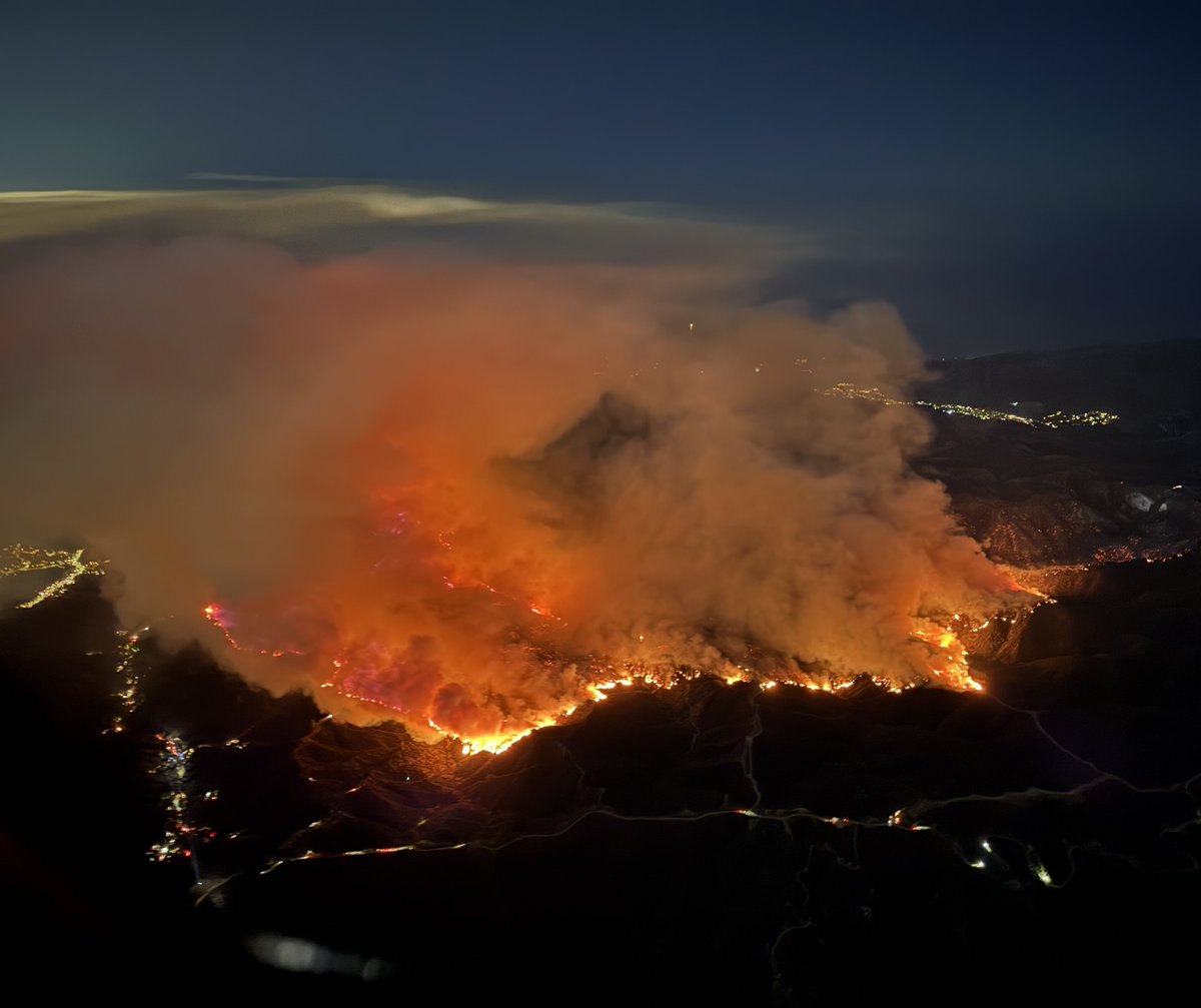 The PalisadesFire is burning in the hills between Brentwood and Encino.  The wind very light and the forward progress of the north flank has almost stopped. The fire has not crossed into the San Fernando Valley, and is nearly stationary west of Mandeville Canyon Rd