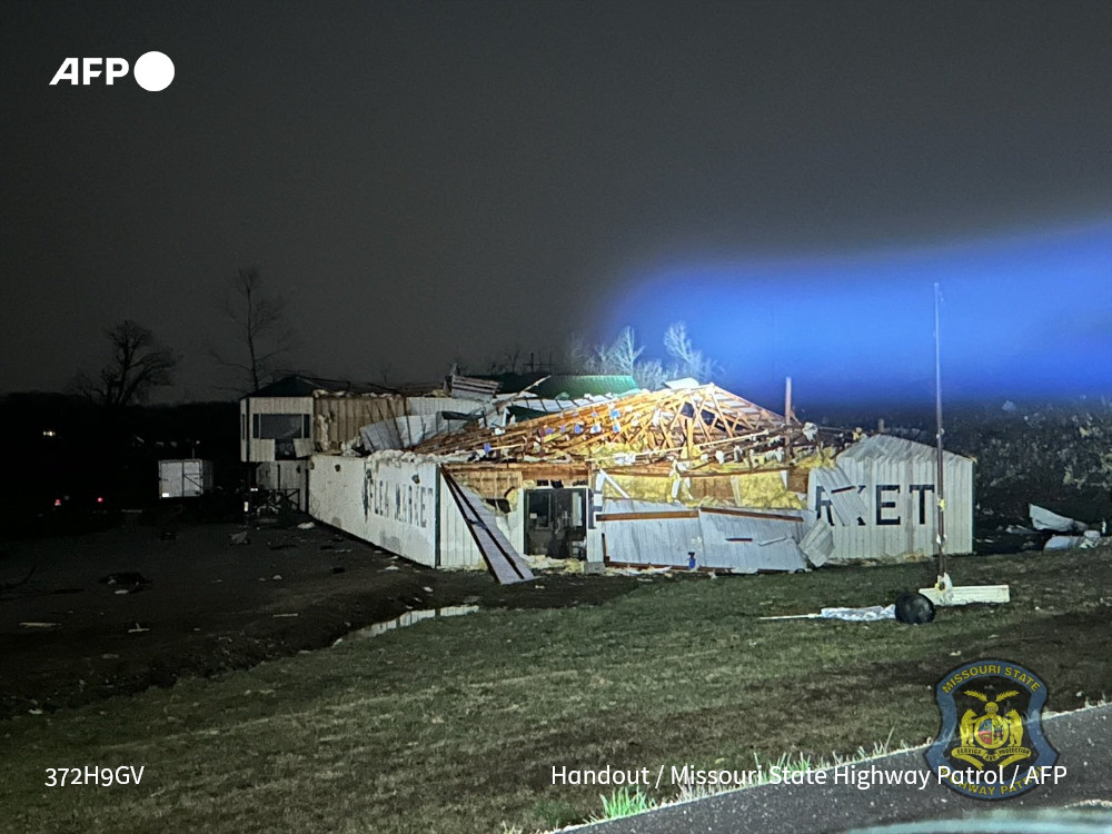 At least 14 people were dead and dozens injured after violent tornadoes swept across the central United States, officials said