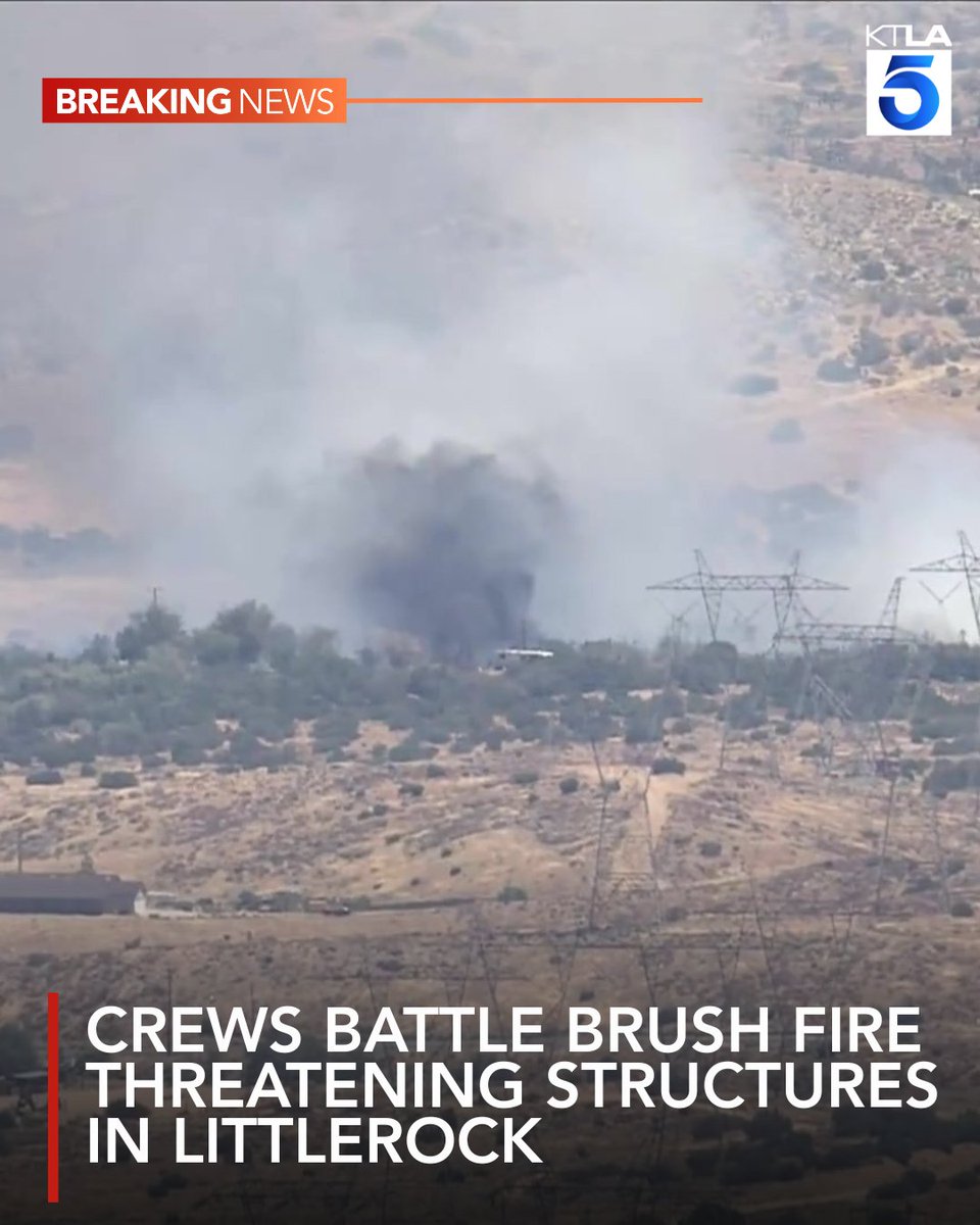 Crews are battling a brush fire that's burning at least 15 acres and threatening structures in Littlerock Tuesday afternoon